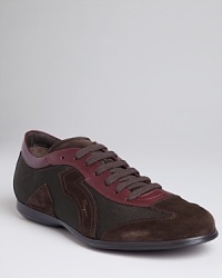 Elevate your casual look with these multi-toned slim sneakers from Salvatore Ferragamo, embellished with suede and leather panels. Elevate your casual look with these multi-toned slim sneakers from Salvatore Ferragamo, embellished with suede and leather panels.