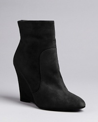 Max Mara strikes the ideal balance between basic and fashion detail in these elegantly crafted wedge booties, with subtle seaming. Max Mara strikes the ideal balance between basic and fashion detail in these elegantly crafted wedge booties, with subtle seaming.