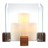 Create an artful showcase of candlelight and favorite objects displayed inside this striking piece from Dansk. In an elegant pairing of raw materials and minimalist design, blocks of richly grained wood support thick panes of sparkling clear glass.