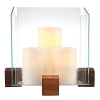 Create an artful showcase of candlelight and favorite objects displayed inside this striking piece from Dansk. In an elegant pairing of raw materials and minimalist design, blocks of richly grained wood support thick panes of sparkling clear glass.