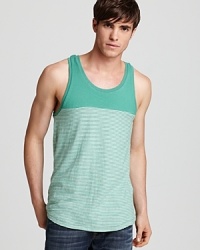 An exciting graphic stripe pattern defines this soft cotton tank from ALTERNATIVE, perfect for trips to the shore or hanging out back on warm weather evenings. An exciting graphic stripe pattern defines this soft cotton tank from ALTERNATIVE, perfect for trips to the shore or hanging out back on warm weather evenings.