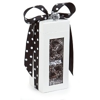 Nicely wrapped in a beautiful box and polka dot black bow, these chocolate-covered confections are a mouthwatering delight - perfect for gift giving. Nicely wrapped in a beautiful box and polka dot black bow, these chocolate-covered confections are a mouthwatering delight - perfect for gift giving.