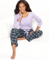 Relax in complete comfort in these pajamas by Nautica. The scoop neck top features an anchor logo on the lower corner of the shirt, while the roomy pants feature contrasting satin lining on the the inside of the elastic waistband.