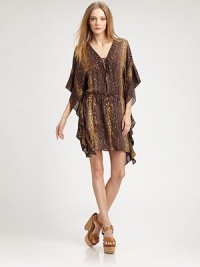 Sultry, semi-sheer silk dress in a sequined animal print with self ties and dramatic kimono sleeves. V-neck with self tieThree-quarter kimono sleevesDrawstring waistbandAbout 17 from natural waistSilk with sequinsDry cleanImportedModel shown is 5'10 (177cm) wearing US size Small. Sultry, semi-sheer silk dress in a sequined animal print with self ties and dramatic kimono sleeves. V-neck with self tieThree-quarter kimono sleevesDrawstring waistbandAbout 17 from natural waistSilk with sequinsDry cleanImportedModel shown is 5'10 (177cm) wearing US size Small.