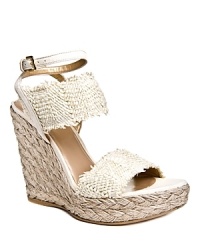 In natural nude, these Stuart Weitzman wedges exude feminine appeal with a bohemian edge. In natural nude, these Stuart Weitzman wedges exude feminine appeal with a bohemian edge.