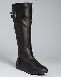 DKNY's signature urban look is captured in these stylish flat boots, with modern, athletic-influenced soles and slick, buckled shafts. DKNY's signature urban look is captured in these stylish flat boots, with modern, athletic-influenced soles and slick, buckled shafts.