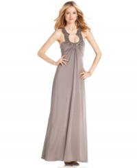 A dazzling jeweled neckline is the eye-catching element on JS Boutique's gorgeous evening gown. Pleating at the bust and back ensures a flattering fit as the dress flares toward the hem.
