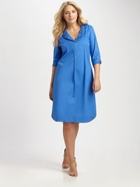 When you think of the quintessential combination of comfort and style, think about this shirtdress. It features a relaxed fit, courtesy of a touch of stretch and a feminine, curved hem.Split neckButton-tab sleevesBust dartsCurved hemAbout 25 from natural hem97% cotton/3% spandexDry cleanMade in USA of imported fabric