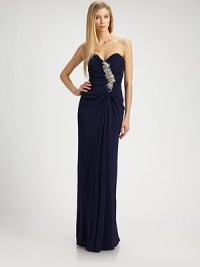 Impeccably draped jersey, embellished with allover ruching and a glamorous beaded detail.Strapless sweetheart necklineJeweled, ruched bodiceFront drapeConcealed back zipFully linedAbout 44 from natural waistpolyester/rayonSpot cleanImportedModel shown is 5'10 (177cm) wearing US size 4.OUR FIT MODEL RECOMMENDS ordering true size. Impeccably draped jersey, embellished with allover ruching and a glamorous beaded detail.Strapless sweetheart necklineJeweled, ruched bodiceFront drapeConcealed back zipFully linedAbout 44 from natural waistpolyester/rayonSpot cleanImportedModel shown is 5'10 (177cm) wearing US size 4.OUR FIT MODEL RECOMMENDS ordering true size.