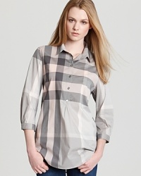 This Burberry Brit top redefines the heritage print with a tonal palette and modern slim silhouette. Team the classic plaid with leather pants for a dose of downtown cool. This Burberry Brit top redefines the heritage print with a tonal palette and modern slim silhouette. Team the classic plaid with leather pants for a dose of downtown cool.
