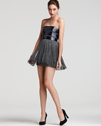 Roaring twenties details go totally modern in this Basix strapless dress, flaunting a sparkling beaded bodice atop a swingy fringe skirt. Roaring twenties details go totally modern in this Basix strapless dress, flaunting a sparkling beaded bodice atop a swingy fringe skirt.
