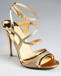 A sparkling sandal from IVANKA TRUMP: the Hailey, glittering in gold, lends radiant style to glamorous evenings. A sparkling sandal from IVANKA TRUMP: the Hailey, glittering in gold, lends radiant style to glamorous evenings.
