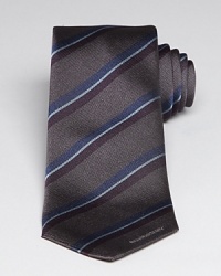 The Earl tie offers a distinctive stripe design with the designer's logo emblazoned at the bottom edge, an appealing touch that signals to everyone your taste for refinement. The Earl tie offers a distinctive stripe design with the designer's logo emblazoned at the bottom edge, an appealing touch that signals to everyone your taste for refinement.