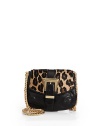 THE LOOKGoldtone shoulder chainLeopard printed calf hair flapBuckle strap front detailSnap flap closureOne inside open pocketInside logo tagTHE FITShoulder chain, 20 drop8½W X 7H X 1½DTHE MATERIALCalf hairLeatherFully linedORIGINImported