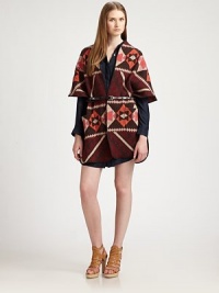 Textile-inspired intarsia knit, styled in a slouchy poncho silhouette with a sleek skinny belt at the waist.Dropped shouldersShort dolman sleevesOpen frontBelted waistPatch pocketsAbout 32 from shoulder to hemWoolDry cleanImportedModel shown is 5'10 (177cm) wearing US size 2. Textile-inspired intarsia knit, styled in a slouchy poncho silhouette with a sleek skinny belt at the waist.Dropped shouldersShort dolman sleevesOpen frontBelted waistPatch pocketsAbout 32 from shoulder to hemWoolDry cleanImportedModel shown is 5'10 (177cm) wearing US size 2.