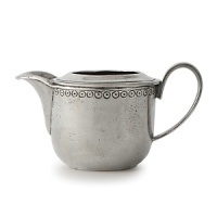 In a nod toward old-world inspiration, talented Italian artisans carefully craft this Arte Italica creamer by hand from the highest-quality pewter and glass. It's enhanced with a delicate pattern reminiscent of vintage lace. In a nod toward old-world inspiration, talented Italian artisans carefully craft this Arte Italica creamer by hand from the highest-quality pewter and glass. It's enhanced with a delicate pattern reminiscent of vintage lace.
