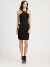 A fashion-forward leather neckline adds edgy appeal to this sleek dress.Leather halter necklineRacerbackSide zipperBack ventAbout 21 from natural waist65% rayon/30% nylon/5% spandexDry clean by leather specialistMade in USA of imported fabricModel shown is 5'10 (177cm) wearing US size Small. A fashion-forward leather neckline adds edgy appeal to this sleek dress.Leather halter necklineRacerbackSide zipperBack ventAbout 21 from natural waist65% rayon/30% nylon/5% spandexDry clean by leather specialistMade in USA of imported fabricModel shown is 5'10 (177cm) wearing US size Small.