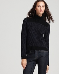 A blue and black zigzag pattern defines this rich Theory turtleneck sweater for a fresh off-duty look to update seasonal staples. A blue and black zigzag pattern defines this rich Theory turtleneck sweater for a fresh off-duty look to update seasonal staples.