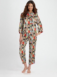 Asian-inspired pajamas look and feel like silk, yet are easily washable. Mandarin collared top Contrast button-and-loop closures Wide three-quarter sleeves with slit cuffs Side slits at hem Full length pant with drawstring waist Piped slit cuffs Polyester; machine wash Imported