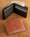 A classic leather bi-fold in comfortably aged leather. Embossed logo on front and embossed logo lettering on interior. Multiple card slots and removable ID holder with window. Imported.