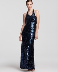 Brilliant sequins lend a glamorous look to a sleek BCBGMAXAZRIA maxi dress--a racerback boasts a sporty silhouette. Brilliant sequins lend a glamorous look to a sleek BCBGMAXAZRIA maxi dress--a racerback boasts a sporty silhouette.