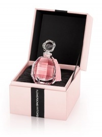 Flowerbomb is a floral explosion, a profusion of flowers that has the power to make everything more positive. Flowerbomb returns to the original, intimate gesture of perfume with an overdose of noble patchouli and reinforced gourmand facets to bring a new intensity to the delicious Flowerbomb fragrance. The new Extrait de Parfum, a bewitching and long-lasting concentrate, is presented in a luxurious jewelry box to reveal the delicately hand-packaged diamond bottle inside. 0.67 oz. Flowerbomb is a floral explosion, a profusion of flowers that has the power to make everything more positive. Flowerbomb returns to the original, intimate gesture of perfume with an overdose of noble patchouli and reinforced gourmand facets to bring a new intensity to the delicious Flowerbomb fragrance. The new Extrait de Parfum, a bewitching and long-lasting concentrate, is presented in a luxurious jewelry box to reveal the delicately hand-packaged diamond bottle inside. 0.67 oz.
