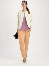 Waffle-textured woven cotton from Italy, simply styled with a wraparound, rounded yoke and hidden hook close.CollarlessOne-piece back yoke wraps around upper sleevesSmooth frontHidden hook closeBracelet length sleevesAbout 24 from shoulder to hemCotton liningCottonDry cleanImported of Italian fabric Waffle-textured woven cotton from Italy, simply styled with a wraparound, rounded yoke and hidden hook close.CollarlessOne-piece back yoke wraps around upper sleevesSmooth frontHidden hook closeBracelet length sleevesAbout 24 from shoulder to hemCotton liningCottonDry cleanImported of Italian fabric