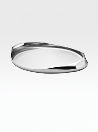 A beautiful reproduction, in polished stainless steel, of Henning Koppel's original, limited edition design in sterling silver. 15W X 2H X 13D Imported A beautiful reproduction, in polished stainless steel, of Henning Koppel's original, limited edition design in sterling silver. 15W X 2H X 13D Imported