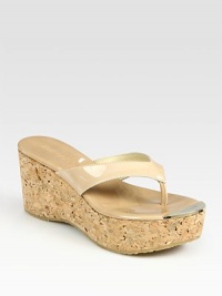 Tastefully textured cork wedge and platform with a shiny patent leather thong. Cork wedge, 3 (75mm)Cork platform, 1½ (40mm)Compares to a 1½ heel (40mm)Patent leather upperLeather liningRubber solePadded insoleMade in SpainOUR FIT MODEL RECOMMENDS ordering one half size down as this style runs large. Tastefully textured cork wedge and platform with a shiny patent leather thong. Cork wedge, 3 (75mm)Cork platform, 1½ (40mm)Compares to a 1½ heel (40mm)Patent leather upperLeather liningRubber solePadded insoleMade in SpainOUR FIT MODEL RECOMMENDS ordering one half size down as this style runs large.