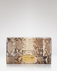 Exotically textured and sized-right for night. Take this season's textured trend out for the night with this luxurious python leather clutch from Michael Kors. Exotically textured and sized-right for night. Take this season's textured trend out for the night with this luxurious python leather clutch from Michael Kors.