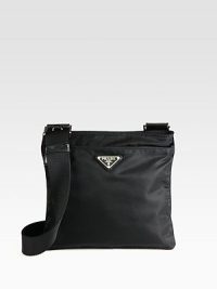 Tessuto nylon flat messenger bag with saffiano leather trim and adjustable shoulder strap. Single adjustable shoulder strap, 12-24 Top zip closure Outside zipper pocket Inside zipper pocket Nylon lining 9¾W X 9H X ¼D Made in Italy Tessuto nylon flat messenger bag with saffiano leather trim and adjustable shoulder strap. Single adjustable shoulder strap, 12-24 Top zip closure Outside zipper pocket Inside zipper pocket Nylon lining 9¾W X 9H X ¼D Made in Italy
