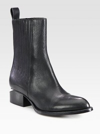 Elastic gores line this leather silhouette, resting on a stacked heel with a modern cut-out shape. Stacked heel, 1¼ (30mm)Leather upper with elastic goresBack pull-tabLeather lining and solePadded insoleImportedOUR FIT MODEL RECOMMENDS ordering true size. Elastic gores line this leather silhouette, resting on a stacked heel with a modern cut-out shape. Stacked heel, 1¼ (30mm)Leather upper with elastic goresBack pull-tabLeather lining and solePadded insoleImportedOUR FIT MODEL RECOMMENDS ordering true size.