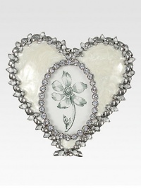 A lovely way to display a photo of one close to your heart, this charming frame of pearly enamel is edged with shimmering Swarovski crystals and silvery accents.Enamel and crystalWhite bronze finishHandmade, hand-enameled and hand-set4.5W X 4.5HMade in USA A lovely way to display a photo of one close to your heart, this charming frame of pearly enamel is edged with shimmering Swarovski crystals and silvery accents.Enamel and crystalWhite bronze finishHandmade, hand-enameled and hand-set4.5W X 4.5HMade in USA
