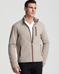Leather accents trim zippered details on Michael Kors' racer jacket, a lightweight layer with a modern, masculine look. Leather accents trim zippered details on Michael Kors' racer jacket, a lightweight layer with a modern, masculine look.