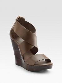 Dramatic width and height gives this crisscross leather sandal stand-out effect. Sculpted wooden wedge, 4½ (115mm) Platform, 1½ (40mm) Compares to a 3 heel (75mm) Back zip closure Leather lining Padded insole Rubber sole ImportedOUR FIT MODEL RECOMMENDS ordering true size.. Dramatic width and height gives this crisscross leather sandal stand-out effect. Sculpted wooden wedge, 4½ (115mm) Platform, 1½ (40mm) Compares to a 3 heel (75mm) Back zip closure Leather lining Padded insole Rubber sole ImportedOUR FIT MODEL RECOMMENDS ordering true size..