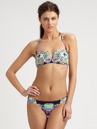 A bold, eclectic print and classic bikini silhouette combine to create an alluring design, including a removable halter strap for style versatility. Removable halter strapBandeau topBack clasp closureSexy, ruched sides on stretch bottomFully lined80% nylon/20% spandexHand washMade in USA