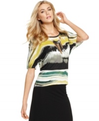 Add dimension to your trove of tops with this style from Kensie, where a roiling sea of color makes for an utterly vibrant print. Add dimension to your trove of tops with this style from Kensie, where a roiling sea of color makes for an utterly vibrant print.