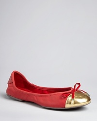 MICHAEL Michael Kors takes these ballet flats from workday to wow with oversized metallic cap toes tied off with a bow with goldtone metal charms. MICHAEL Michael Kors takes these ballet flats from workday to wow with oversized metallic cap toes tied off with a bow with goldtone metal charms.