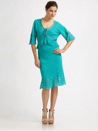 Pretty details like open-stitch panels and woven ribbon accents defines this airy tiered knit.V necklineLace-up frontElbow flutter sleevesRuffled peplum at bodiceRuffled hemAbout 28 from natural waist67% linen/33% cottonDry cleanMade in USA of Italian fabricModel shown is 5'10 (177cm) wearing US size Small. Pretty details like open-stitch panels and woven ribbon accents defines this airy tiered knit.V necklineLace-up frontElbow flutter sleevesRuffled peplum at bodiceRuffled hemAbout 28 from natural waist67% linen/33% cottonDry cleanMade in USA of Italian fabricModel shown is 5'10 (177cm) wearing US size Small.