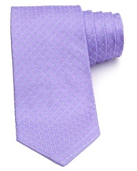 A diamond pane backdrop is peppered with dots for modern elegance. Feature this tie with a light-colored button down for a stately combination. A diamond pane backdrop is peppered with dots for modern elegance. Feature this tie with a light-colored button down for a stately combination.
