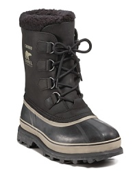 This rugged all-weather boot from Sorel keeps you warm and dry under any conditions, with a rubber shell toe and sides, waterproof leather upper and cozy sherpa cuff. This rugged all-weather boot from Sorel keeps you warm and dry under any conditions, with a rubber shell toe and sides, waterproof leather upper and cozy sherpa cuff.