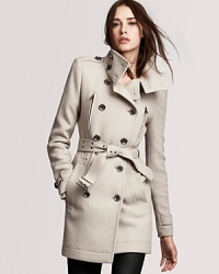 A funnel neck softens the structured silhouette of this Burberry Brit military-inspired coat--effortless allure at its best. A funnel neck softens the structured silhouette of this Burberry Brit military-inspired coat--effortless allure at its best.