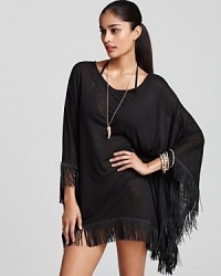 Be the head poncho in this fringed style from, L*Space, boasting a breezy silhouette and bohemian detailing. It's a splashy way to take cover. Be the head poncho in this fringed style from, L*Space, boasting a breezy silhouette and bohemian detailing. It's a splashy way to take cover.