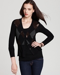 Preppy argyle meets high-fashion shine in a Bailey 44 sweater you can really cozy up to this season. Preppy argyle meets high-fashion shine in a Bailey 44 sweater you can really cozy up to this season.