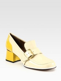 Tonal patent leather forms this loafer-inspired pump with a moderate block heel and adjustable buckle strap. Self-covered heel with metal insert, 2 (50mm)Patent leather upperAdjustable buckle strapLeather lining and solePadded insoleMade in Italy