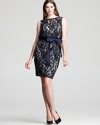 This feminine Tadashi Shoji Plus dress is both sweet and sophisticated, dressed up in detailed lace and finished with a grosgrain bow. This feminine Tadashi Shoji Plus dress is both sweet and sophisticated, dressed up in detailed lace and finished with a grosgrain bow.