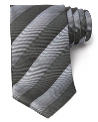 Thin tonal stripes dash across this handsome tie, rendered in luxurious Italian silk for classic opulence. Thin tonal stripes dash across this handsome tie, rendered in luxurious Italian silk for classic opulence.