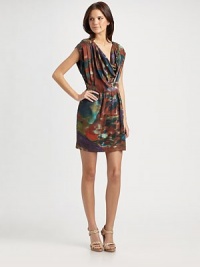 Liquid silk punctuated with artistic brushstrokes, comes with a graceful cowl neckline and side pleats.Cowlneck Cap sleeves Pleated sides Front slash pockets About 32¼ from shoulder to hem Silk; dry clean Imported Liquid silk punctuated with artistic brushstrokes, comes with a graceful cowl neckline and side pleats.Cowlneck Cap sleeves Pleated sides Front slash pockets About 32¼ from shoulder to hem Silk; dry clean Imported
