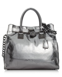 A shining example of exquisite style, this mod metallic tote from MICHAEL Michale Kors features croc-embossed leather with gleaming signature trim. Spacious, versatile and destined to be your go-to silhouette of the season. A shining example of exquisite style, this mod metallic tote from MICHAEL Michale Kors features croc-embossed leather with gleaming signature trim. Spacious, versatile and destined to be your go-to silhouette of the season.