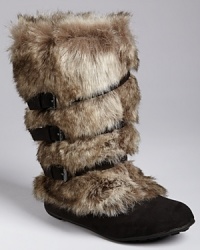 Her fabulous feet need nothing less than KORS by Michael Kors' lovely faux-fur boot. The soft microsuede shaft rises to the calf and is secured by a series of buckled straps and a secret interior zip closure.